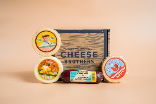 Cheese Brothers Inc. Cheese & Sausage Sampler 4-Pack with assorted cheeses and sausages, ideal for gift and snack bundles.