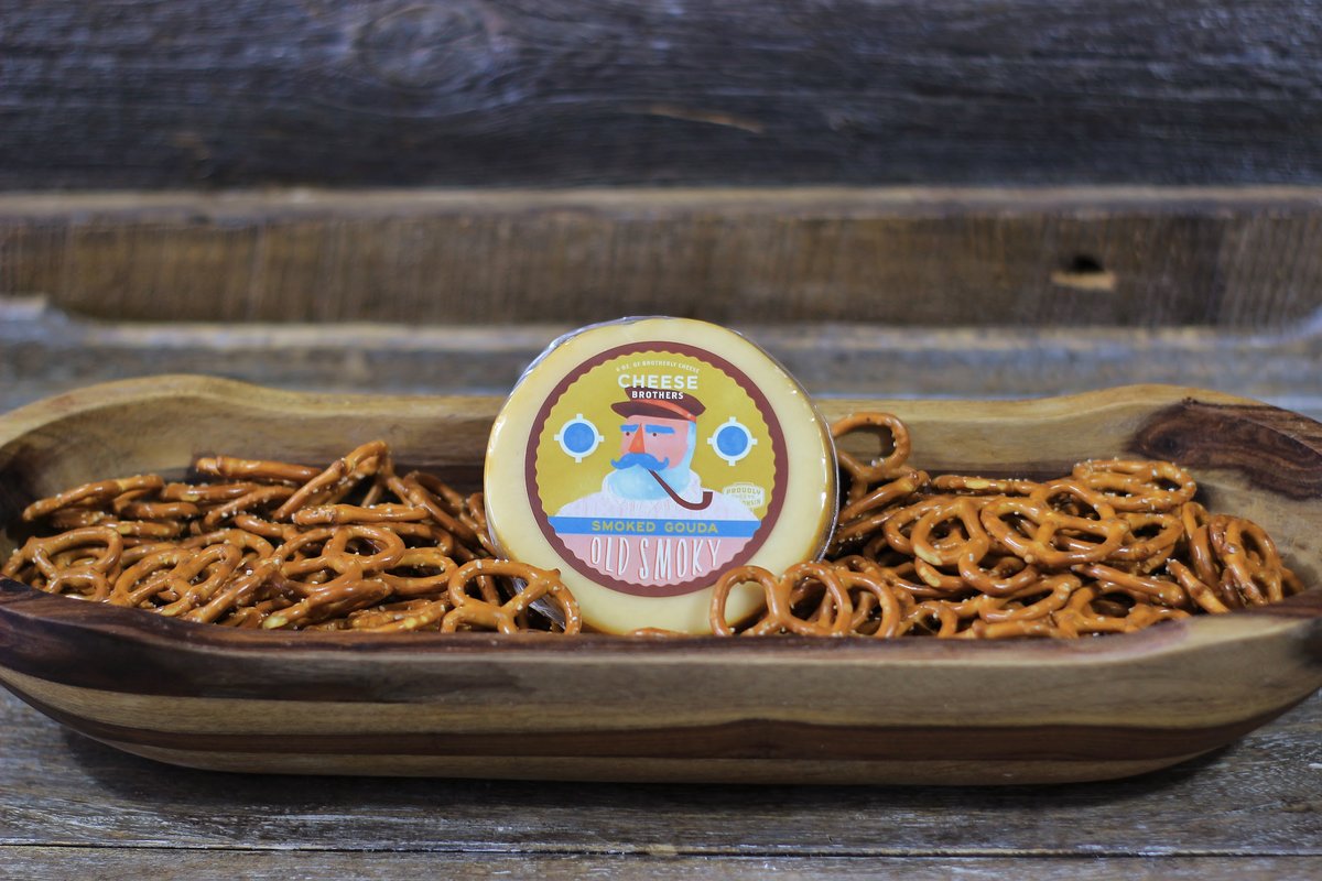 Cheesy Birthday gift basket from Cheese Brothers Inc. with assorted cheeses, snacks, and birthday-themed treats.