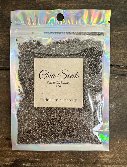 Dried chia seeds in a 1oz package from HerbalRoseApothecary, showing small, oval, grayish-brown seeds on a white background.
