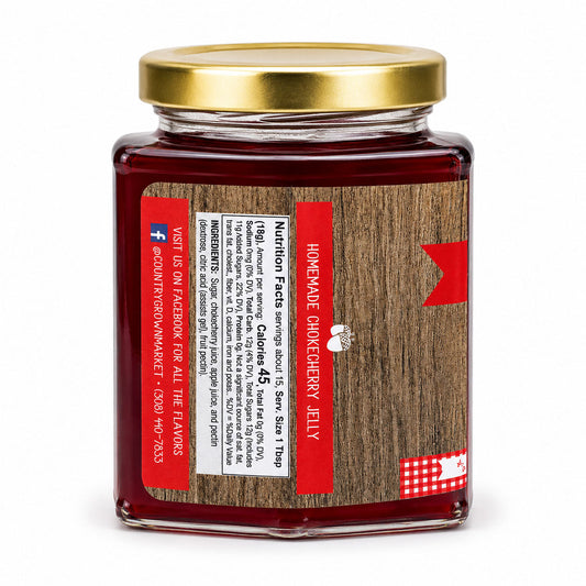 9 oz jar of Nutt Family Jams chokecherry jelly showing the jar with a dark red jam inside.