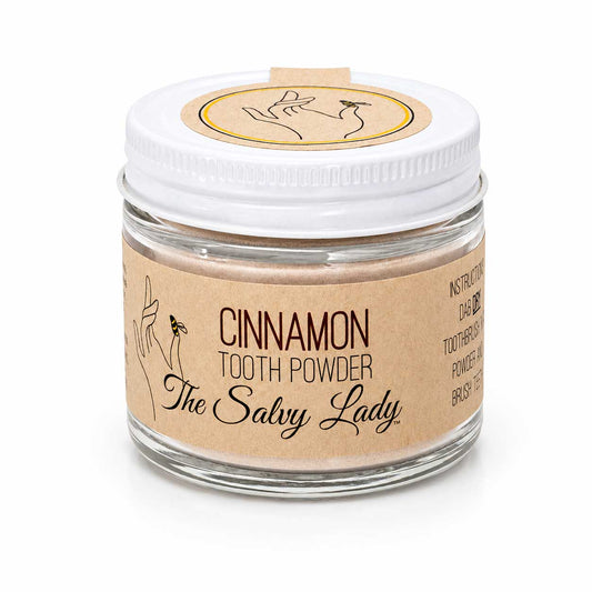 BuyNebraska.com cinnamon-flavored fluoride-free tooth powder in a 2 oz container, designed for natural oral care.