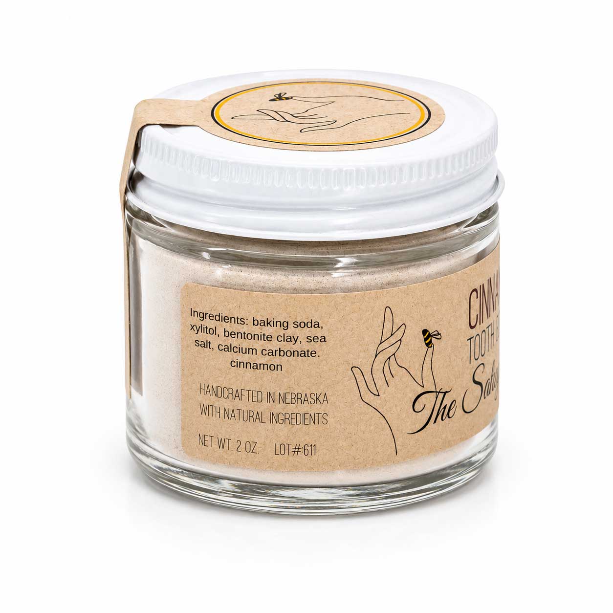 Cinnamon-flavored fluoride-free tooth powder in a 2 oz container from The Salvy Lady, suitable for oral hygiene.
