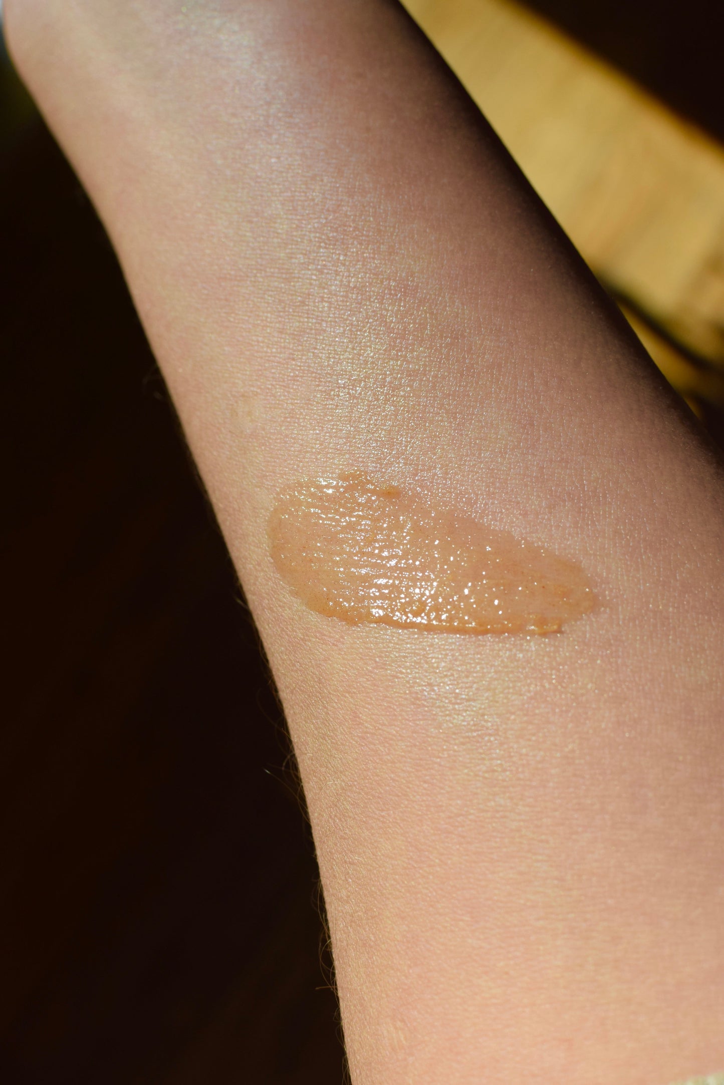 Cinnamon Lip Plumper by plant makeup showing a close-up of lips with a glossy cinnamon-colored finish