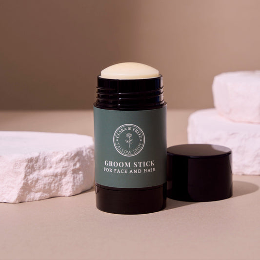Clara & Fritz Tallow Shop Groom Stick with natural ingredients, showing a sleek container and grooming product for pets.