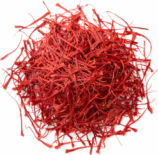 Close-up of bright red Super Negin grade saffron threads in a small pile, showcasing premium quality from Vanilla Bean Kings.