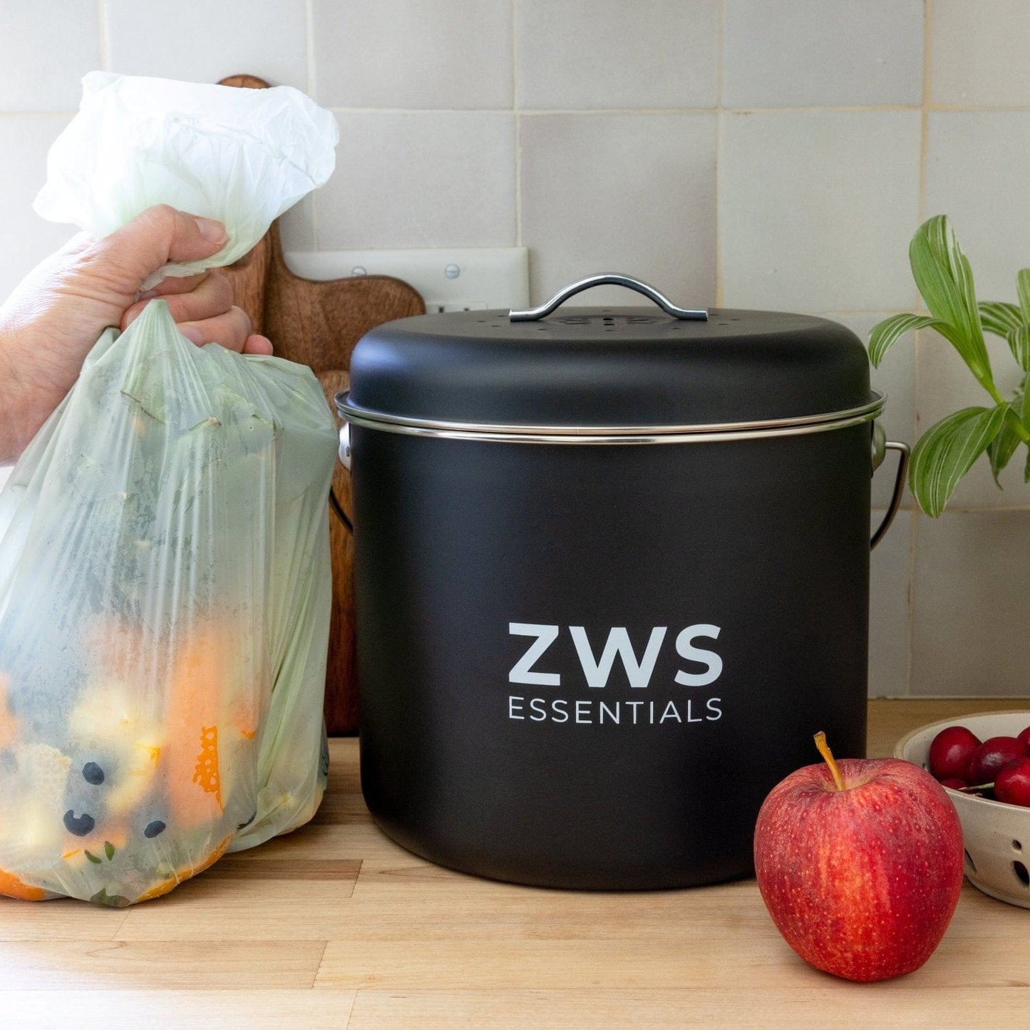 Black countertop compost bin kit by ZeroWasteStore.com for kitchen composting, with a sleek design and easy-to-use lid.