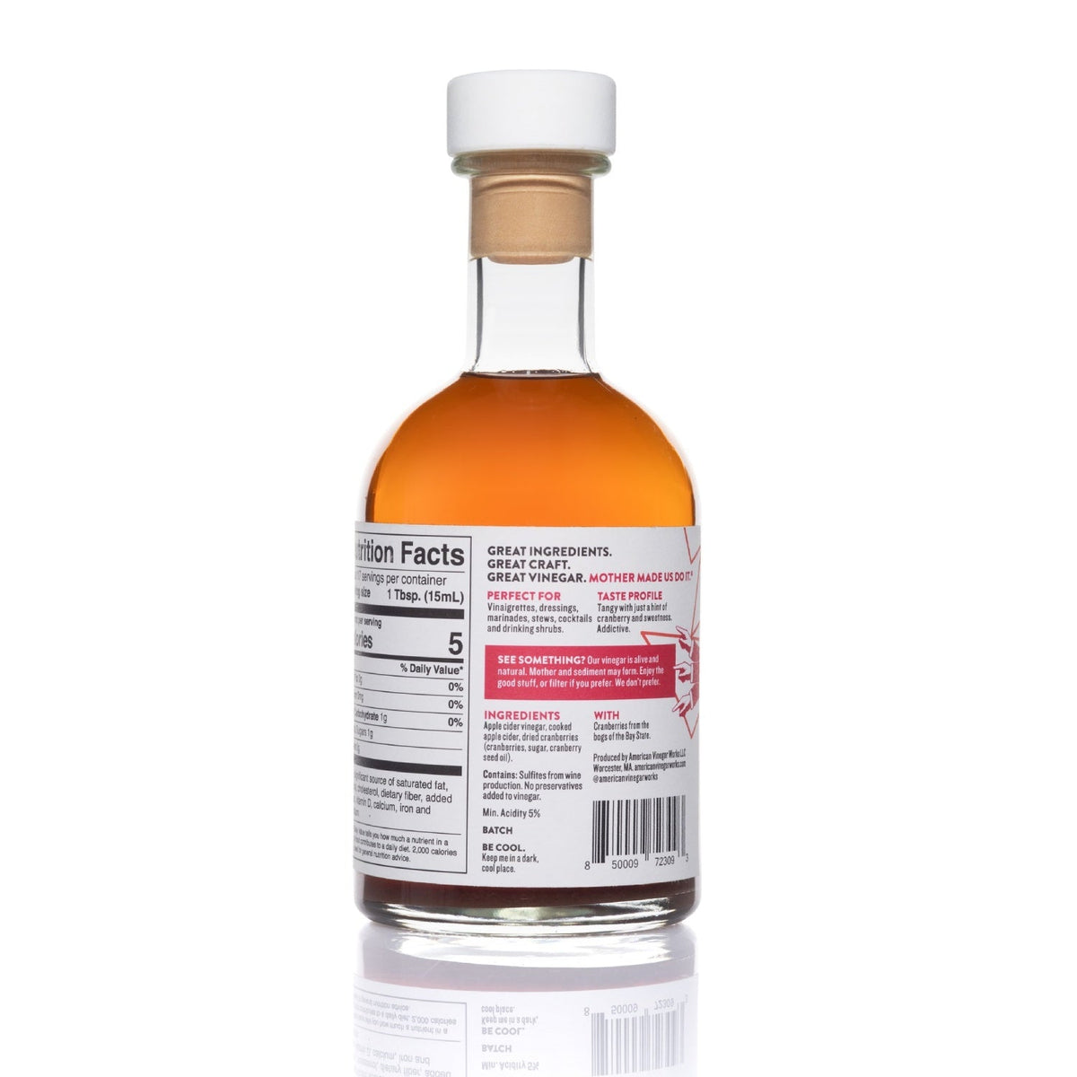 Back view of 250ml bottle of American Vinegar Works cranberry apple cider vinegar showing label and clear glass bottle.