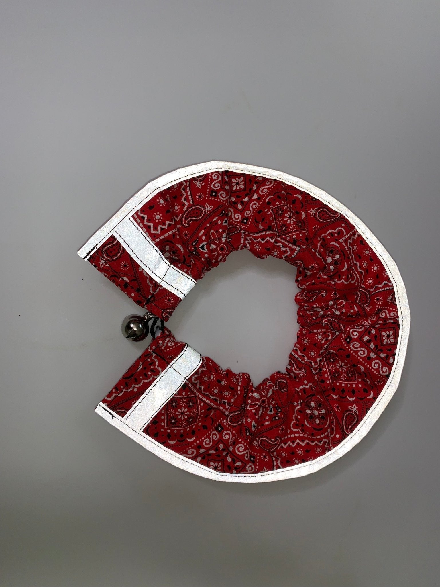 Red breakaway cat collar with bandana from Crazy K Farm Pet and Poultry, designed for safety and comfort for cats.
