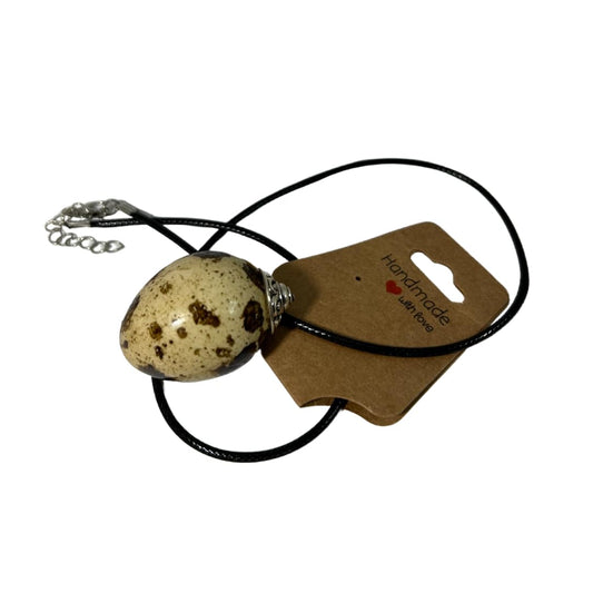 Handcrafted quail egg necklace with delicate silver chain, featuring unique speckled quail egg pendant, from Quailz.com by Undique LLC