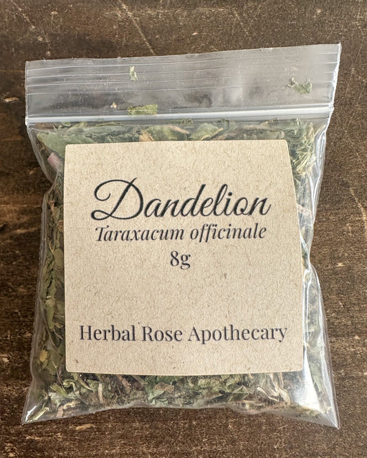 Dried dandelion herbs in an 8g package from HerbalRoseApothecary, showing vibrant yellow dandelion flowers and green leaves.