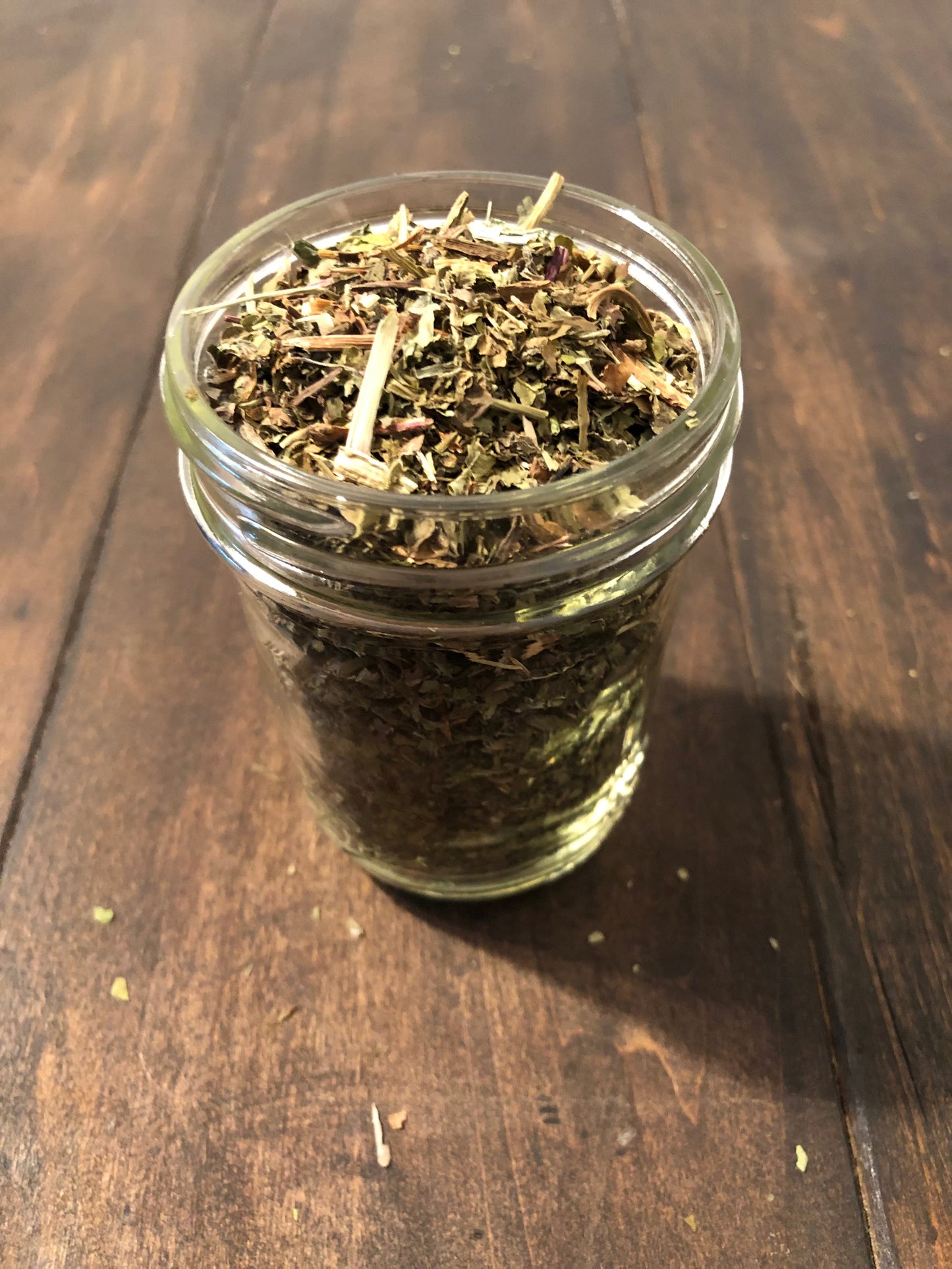 Small jar of dried dandelion herbs in herbalroseapothecary herb jar for herbal remedies and natural health.