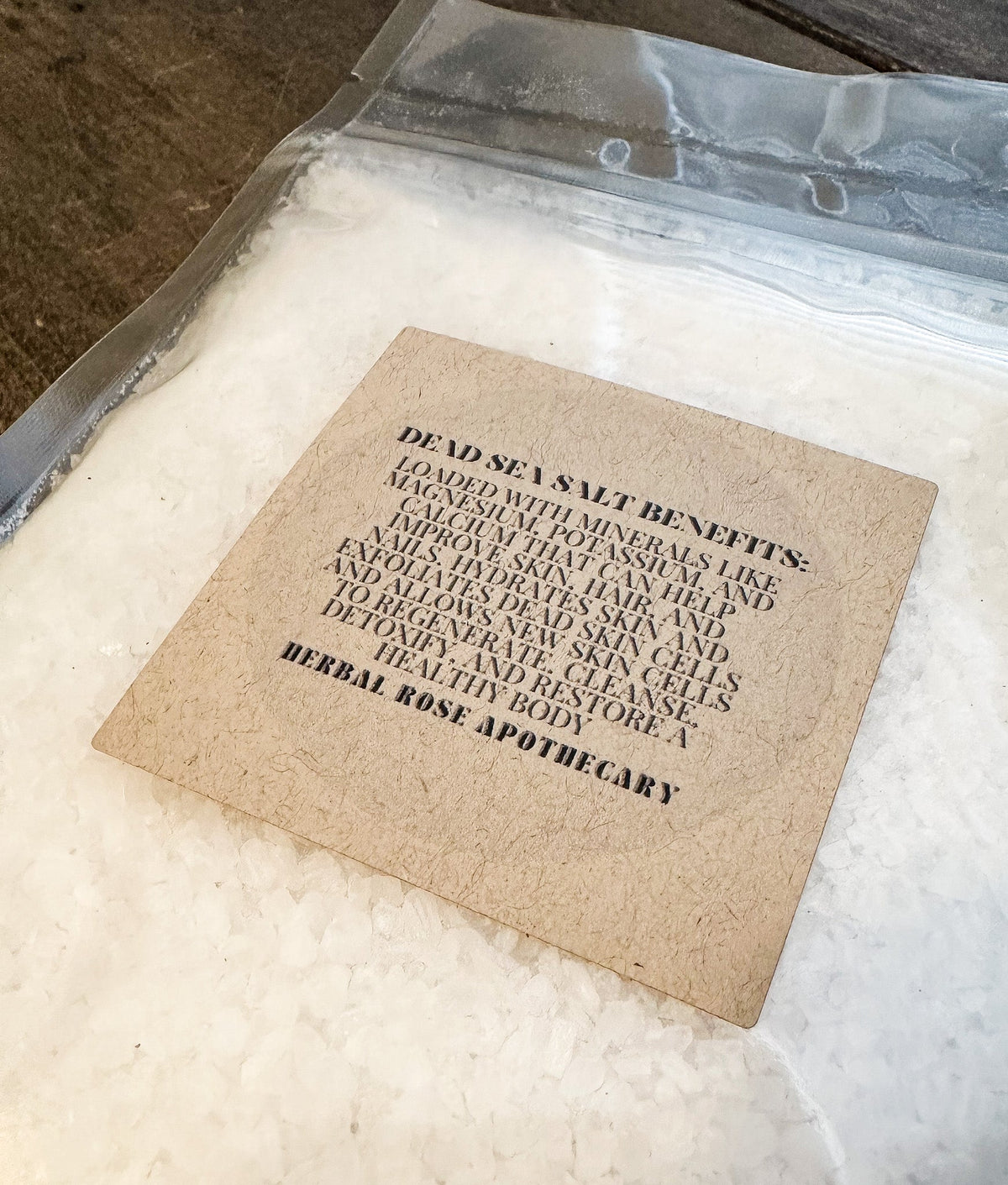 HerbalRoseApothecary Dead Sea Salt with oats, showing coarse salt crystals and natural ingredients for skincare and relaxation.