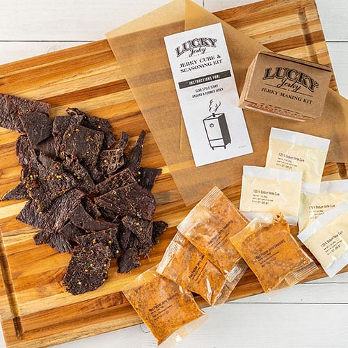 Sweet and spicy jerky making kit from Nebraska Star Beef with 12 oz of ingredients and tools for homemade jerky.