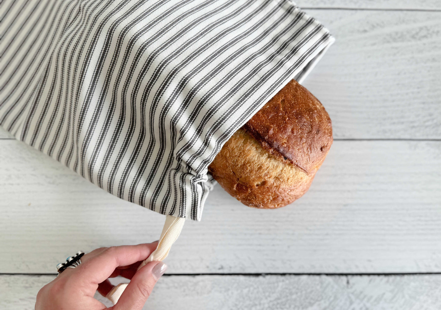 Set of two grey ticking stripe bread bags for breadmakers by Dot and Army, with a classic fabric design for storing baked goods.