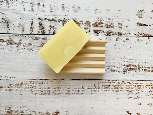 Set of two wooden soap dishes from Dot and Army, natural bamboo cleaning tools for soap storage and drainage.