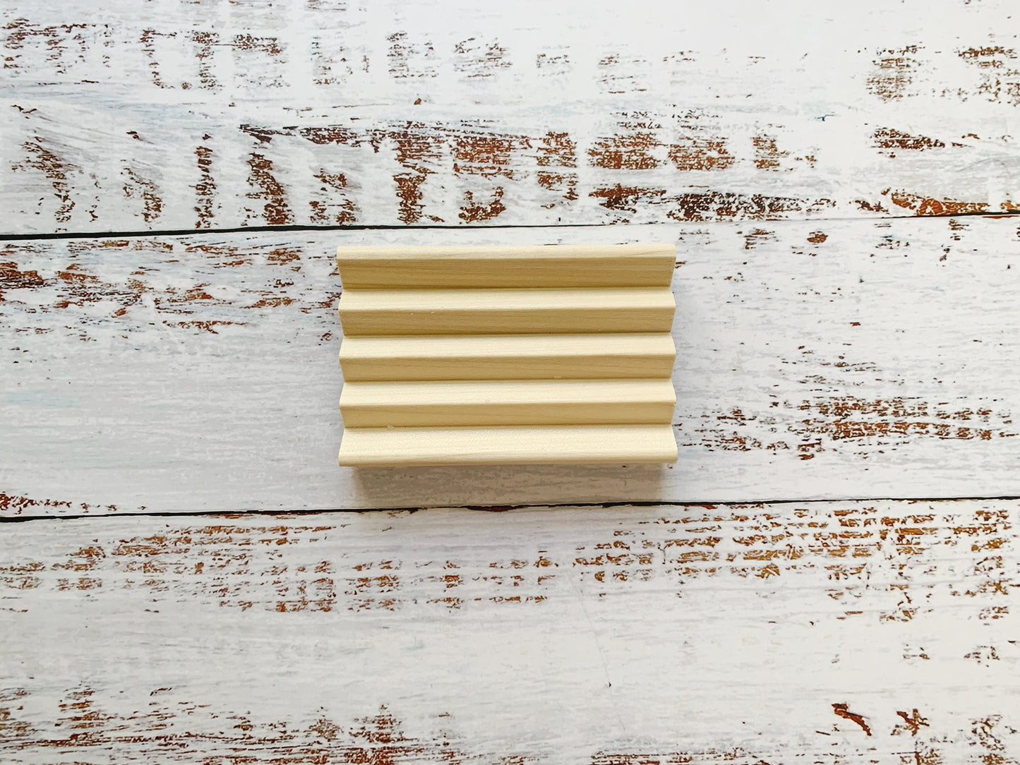 Set of two wooden soap dishes from Dot and Army, natural bamboo cleaning tools for holding soap bars.