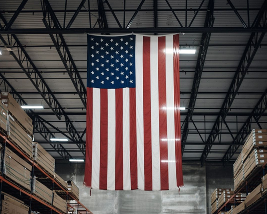 Double-sided American flag for vertical display by Flagman of America, made in the USA, showcasing stars and stripes.