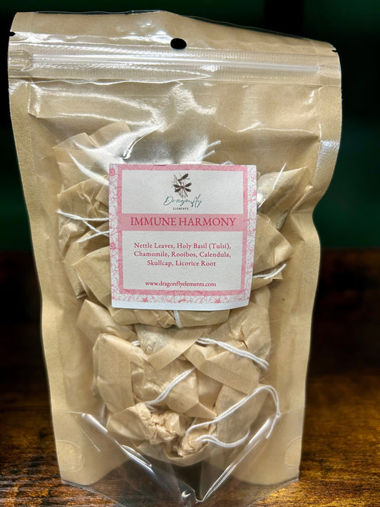 Five sachets of Dragonfly Elements Immune Harmony Herbal Tea featuring herbal tea sachets on a neutral background.