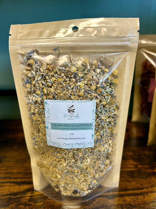 A 1 oz. package of Dragonfly Elements Chamomile & Lavender Herbal Tea Blend with dried chamomile flowers and lavender buds.