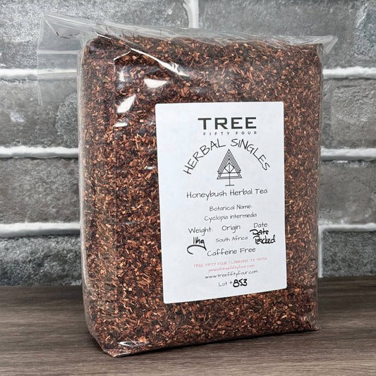 Honeybush herbal tea from Dragonfly Elements in a 1 oz package, showcasing dried honeybush leaves and herbs.