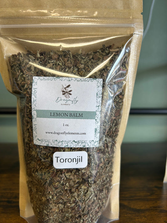 Organic lemon balm leaves in a 1oz package from Dragonfly Elements, showcasing fresh, green herbal leaves for tea or herbal remedies.