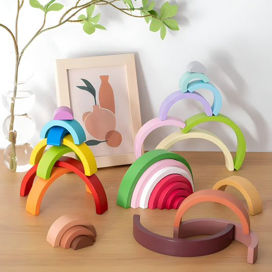 Small wooden rainbow arch blocks by Petite Pioneers, colorful and smooth-edged for children’s stacking and imaginative play.