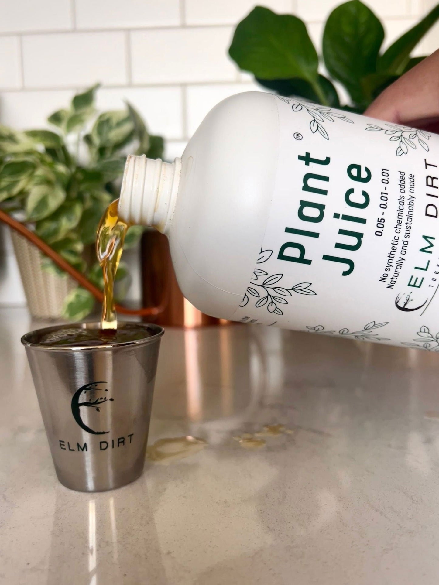 Elm Dirt Plant Care Kit fertilizer box with natural ingredients, designed for healthy plant growth and vibrant foliage.