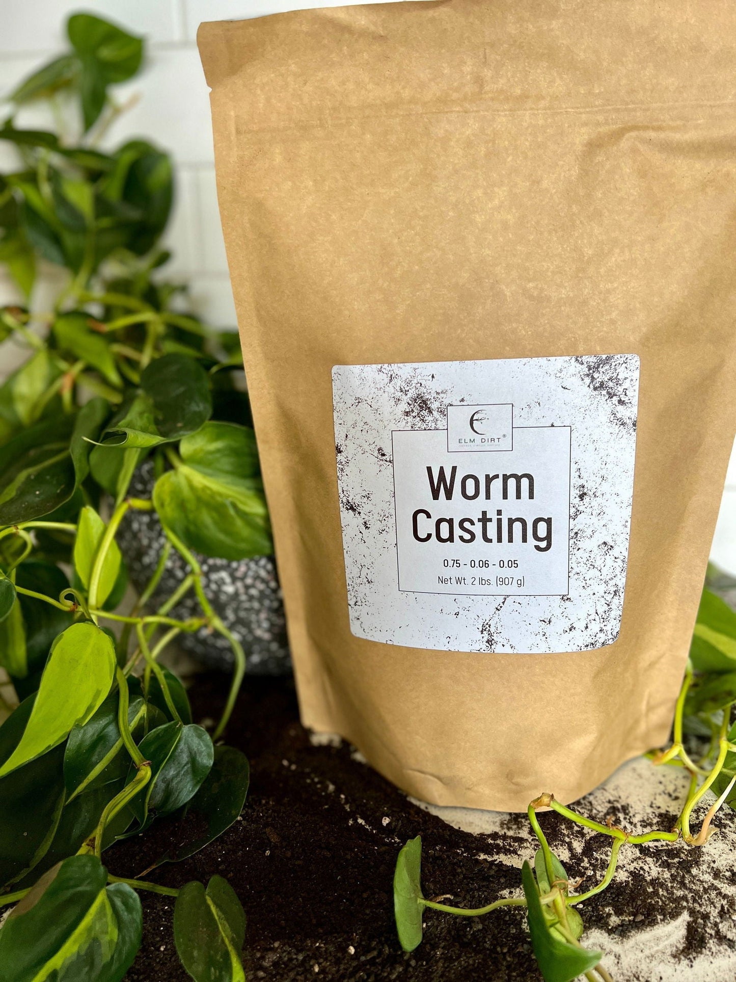 Two pounds of Elm Dirt worm castings, organic soil amendment with rich, dark worm compost for healthy plant growth.