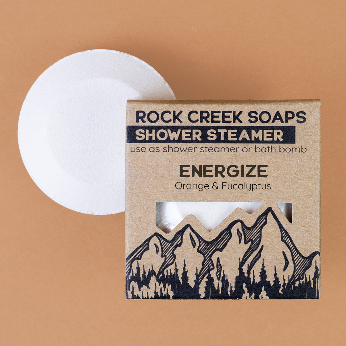 Colorful Rock Creek Soaps Energize shower steamer for shower and bath, with vibrant hues and invigorating scent.