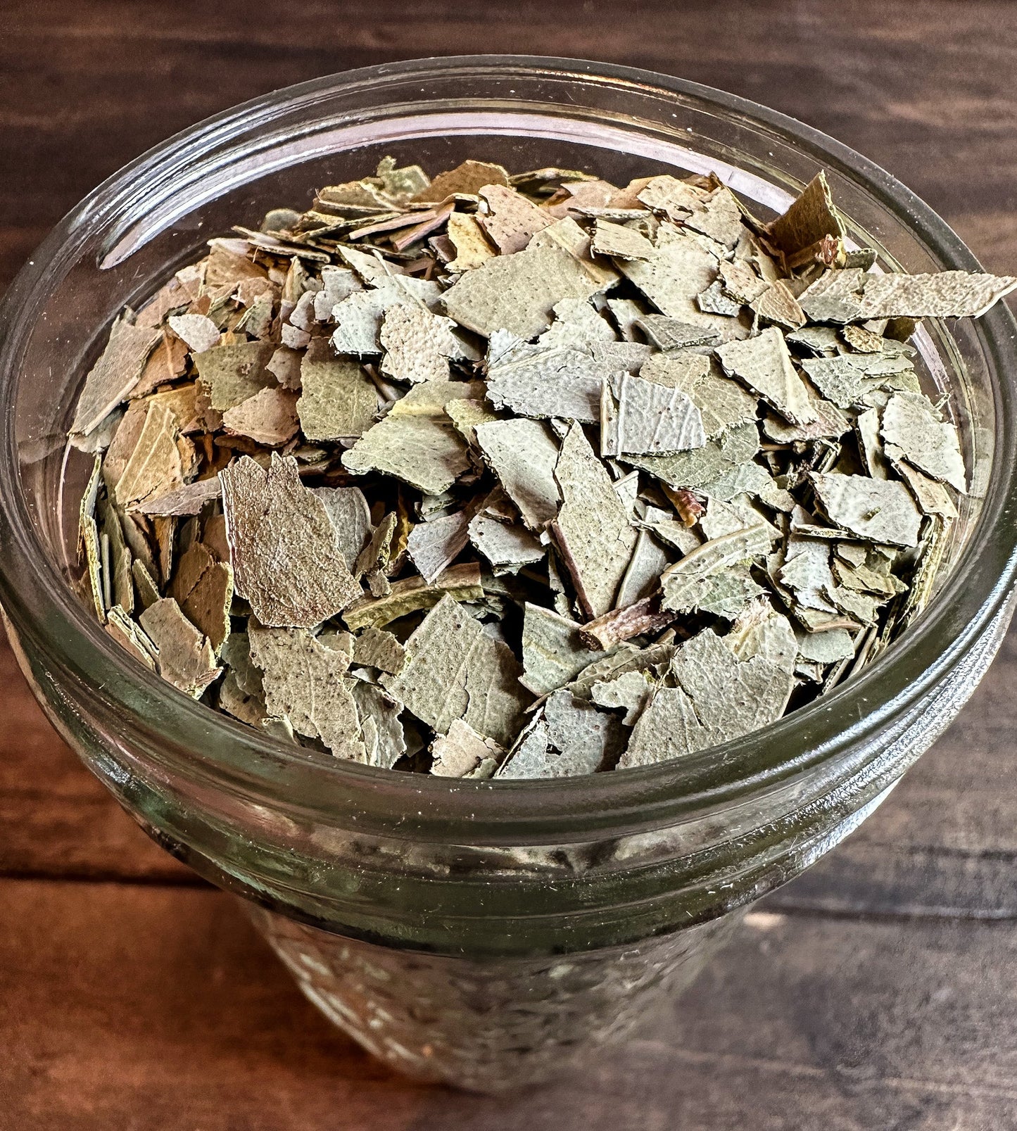 Small jar of dried eucalyptus herbs in herbalroseapothecary herb jar collection, showcasing natural dried eucalyptus leaves.