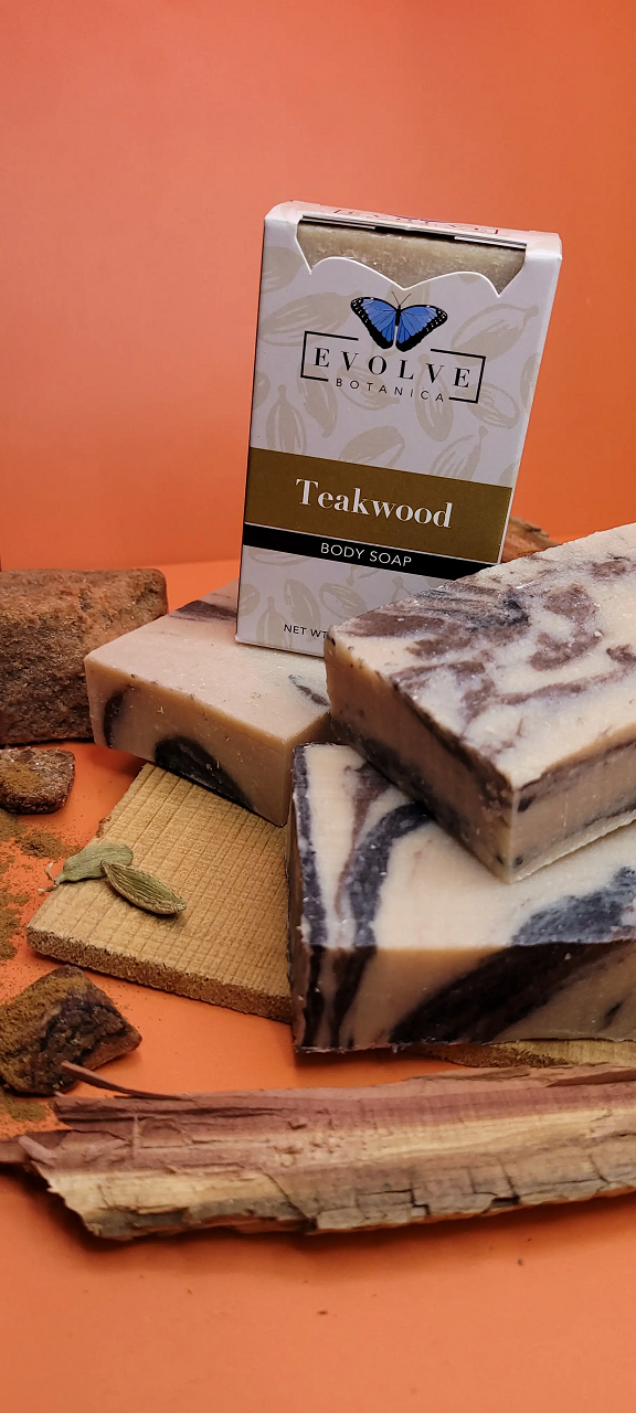 Evolve Botanica Standard Soap with teakwood scent in branded packaging, featuring a bar of soap with natural teakwood fragrance.
