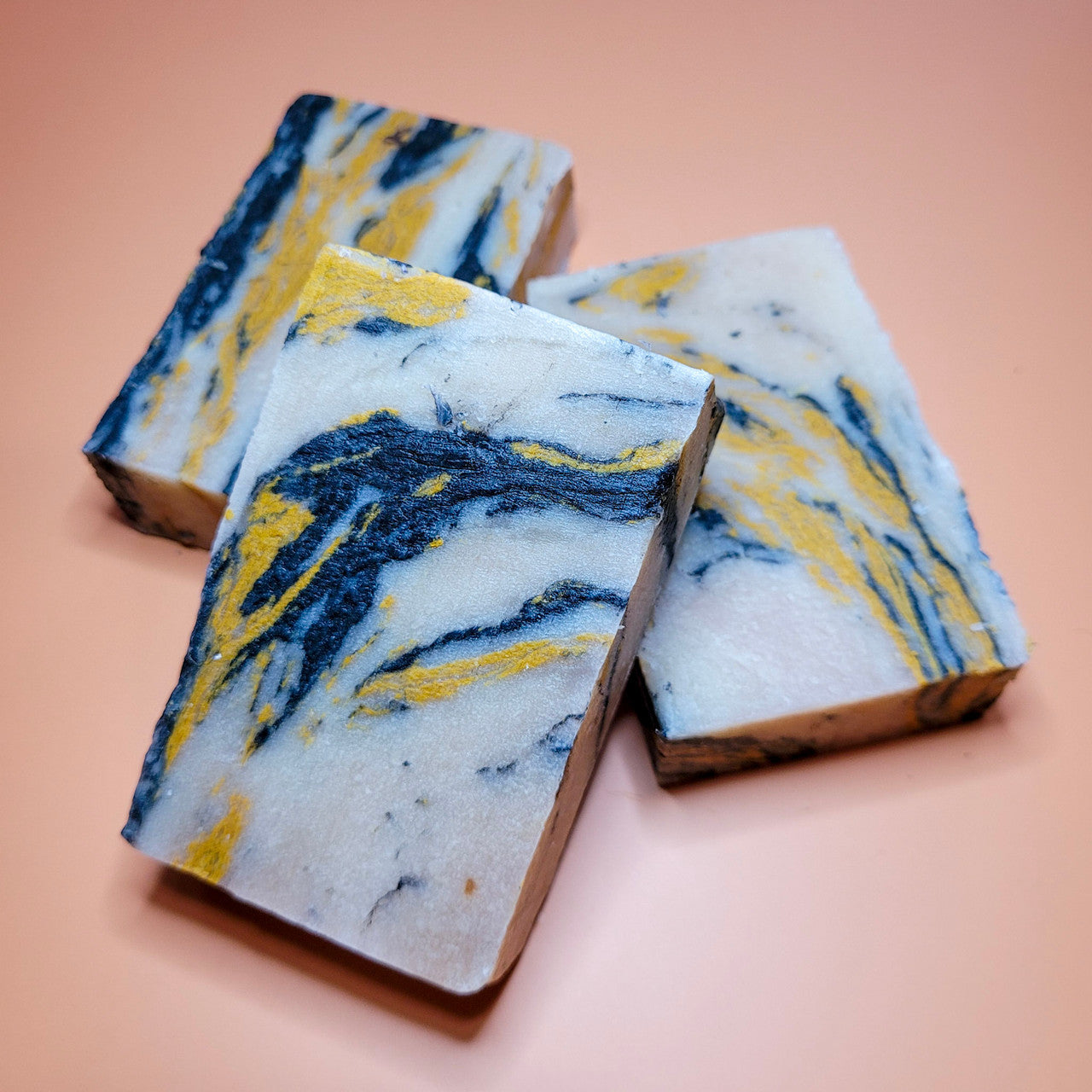Evolve Botanica Standard Soap in teakwood scent, with branded packaging and natural ingredient labels visible.