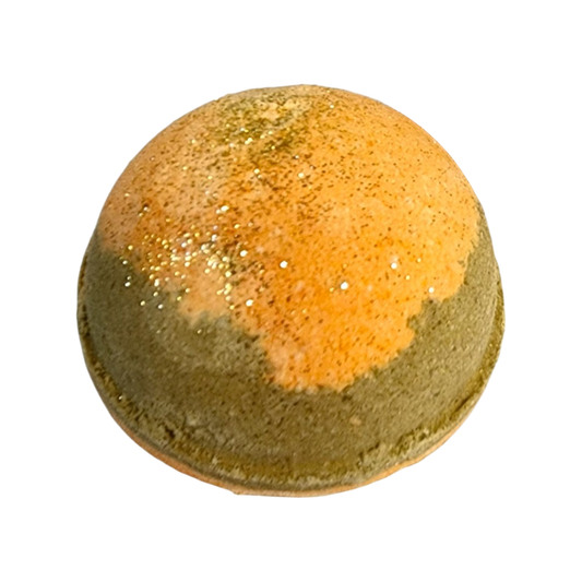 Evolve Botanica Gingersnapped Christmas holiday bath bomb with warm spices and festive packaging in a close-up shot.