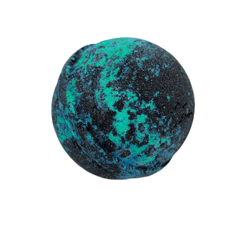 Evolve Botanica Hemlock & Fern bath bomb with green and earthy tones, seasonal scent, round shape, and botanical accents.