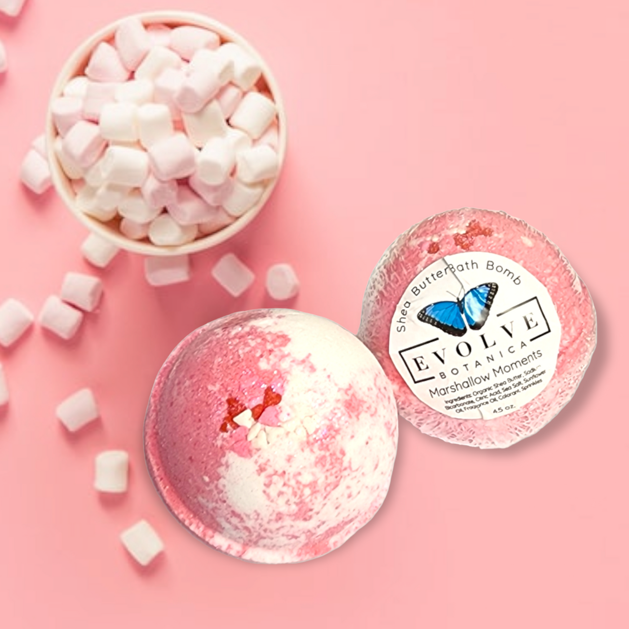 Evolve Botanica Marshmallow Moments bath bomb for Valentine's Day with white and pink swirls, relaxing floral scent.
