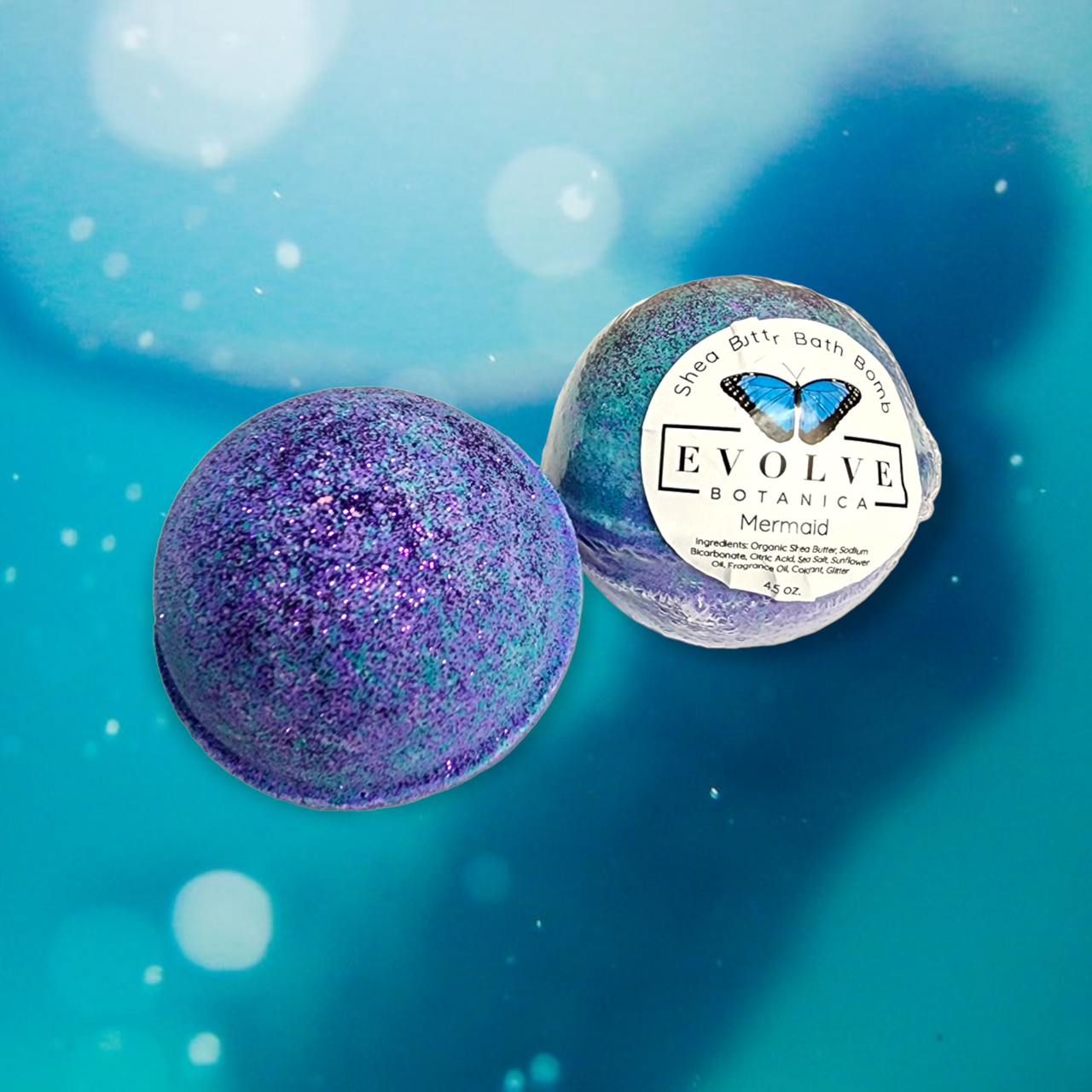 Evolve Botanica Mermaid Bath Bomb showing vibrant colors and seashell design for a relaxing bath experience