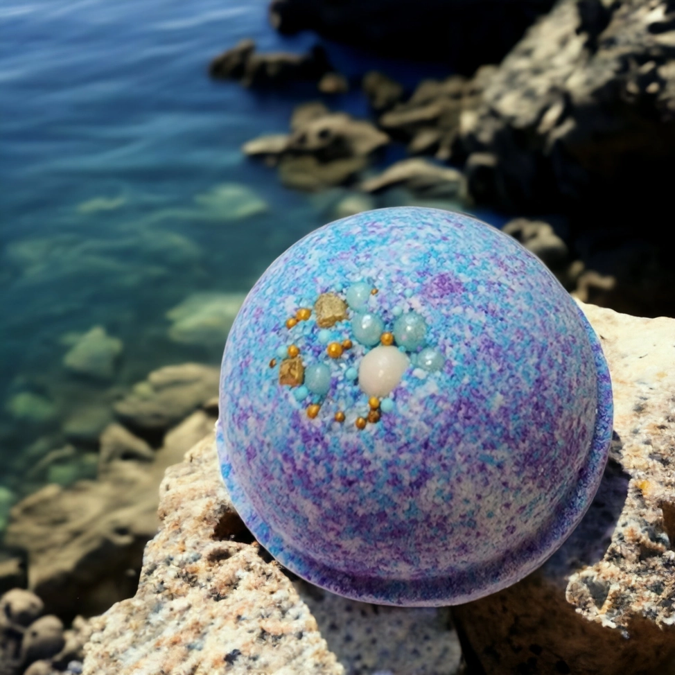 Evolve Botanica Sea Glass bath bomb with vibrant blue and green swirls, dissolving in a bathtub for a relaxing soak.