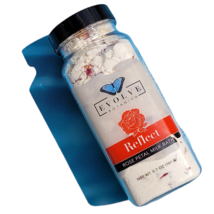 Evolve Botanica Milk Bath Reflect with Rose, soothing bath product in a jar with rose petals and creamy texture.