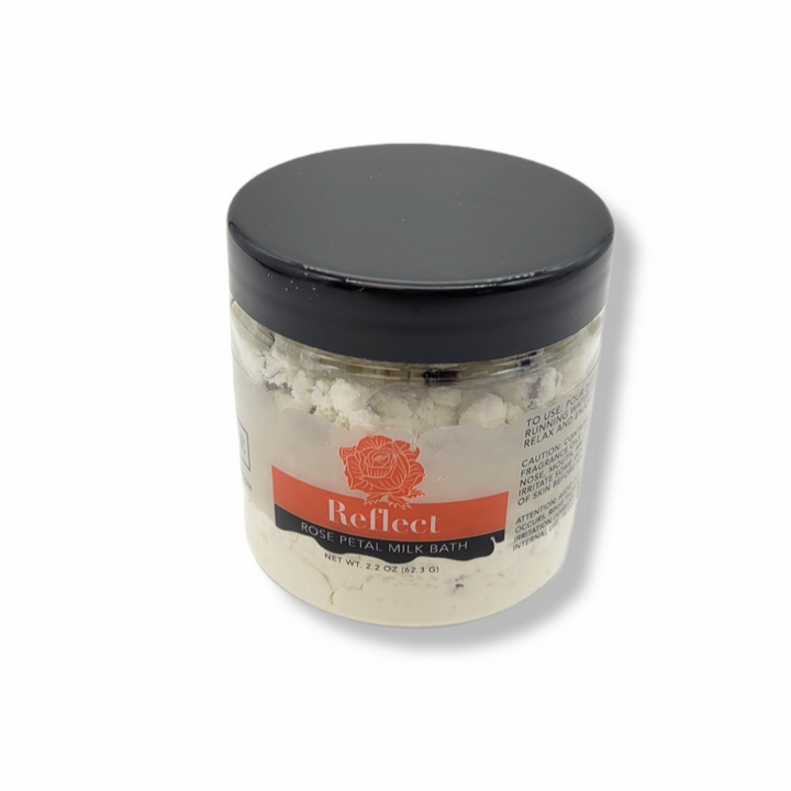 Mini Evolve Botanica Milk Bath Reflect Rose with pink floral and creamy bath salts in a glass jar for a relaxing skincare experience.