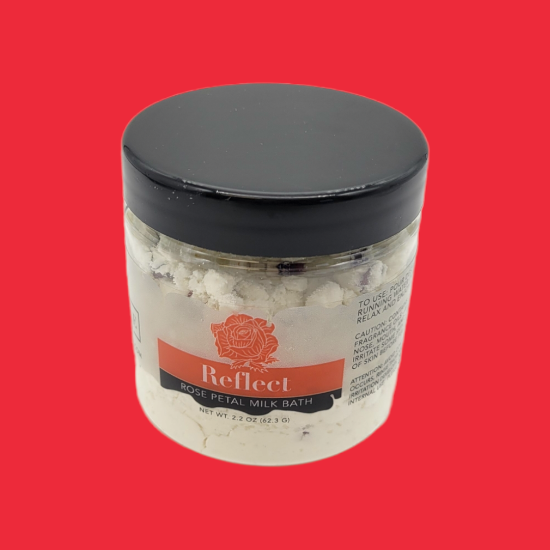 Mini Milk Bath Reflect (Rose) by Evolve Botanica in a jar with pink rose petals and creamy bath salts for a relaxing soak.