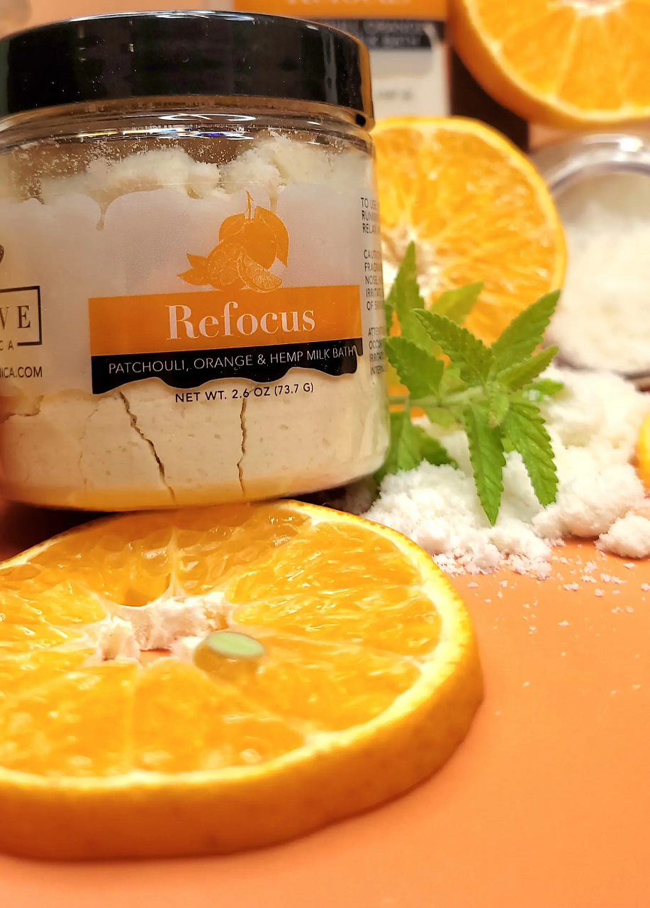 Mini Milk Bath by Evolve Botanica with patchouli, orange, and hempseed oil, showcasing a relaxing, natural bath product.