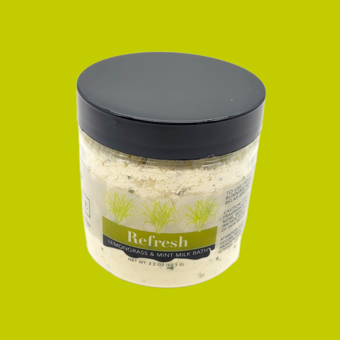 Mini Evolve Botanica Milk Bath Refresh with lemongrass and mint, featuring a calming bath product in a clear container.