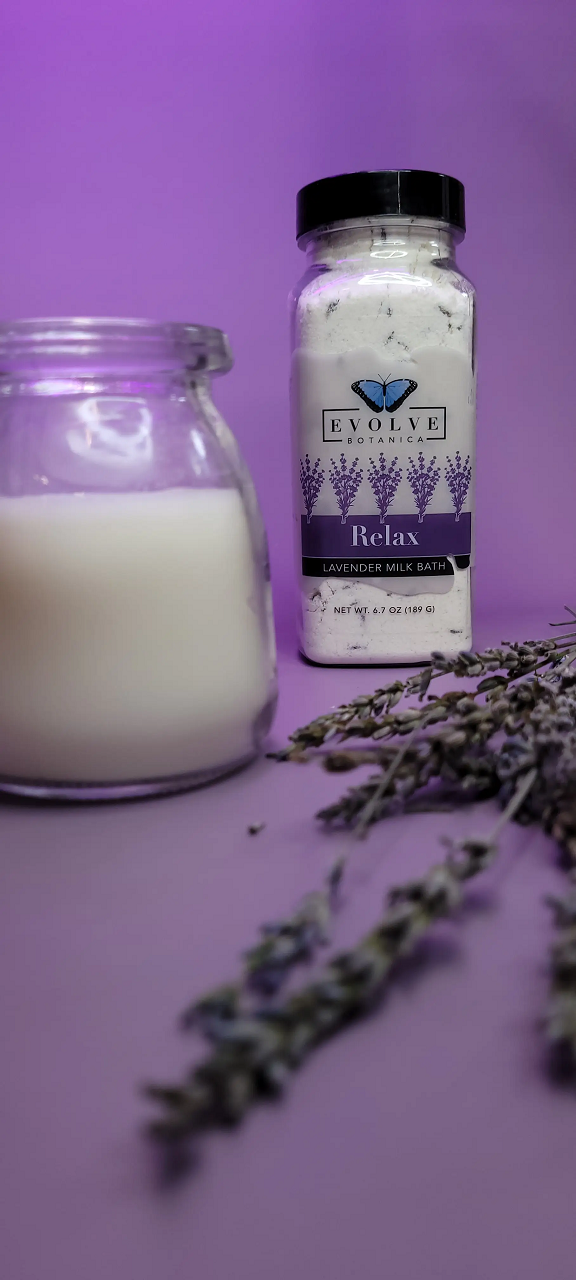 Evolve Botanica Lavender Milk Bath Relax with lavender flowers and creamy milk in a soothing bath setting.