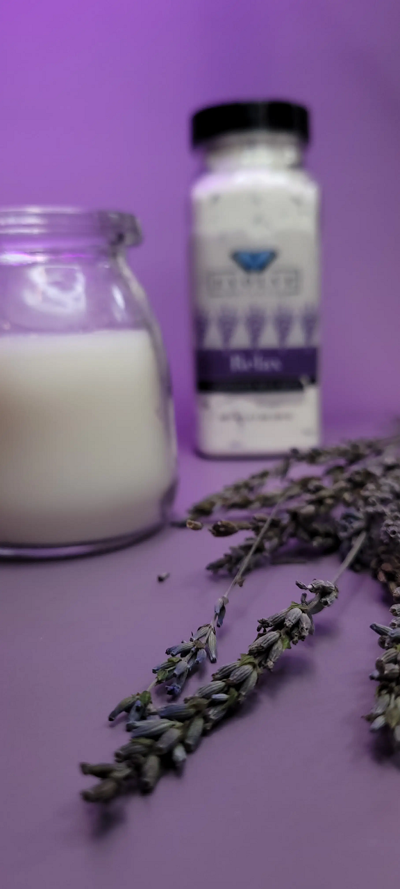 Evolve Botanica Relax Lavender Milk Bath with lavender flowers and creamy bath salts for calming, soothing bath experience.