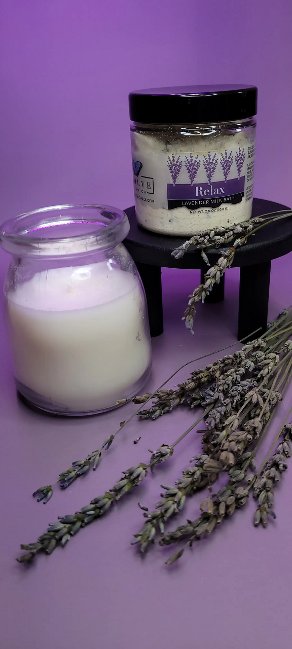 Mini lavender milk bath by Evolve Botanica, featuring soothing lavender flowers and creamy milk bath ingredients in a relaxing setting.