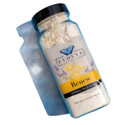 Evolve Botanica Milk Bath Renew with herbal ingredients in a glass jar, showcasing a soothing herbal milk bath product.
