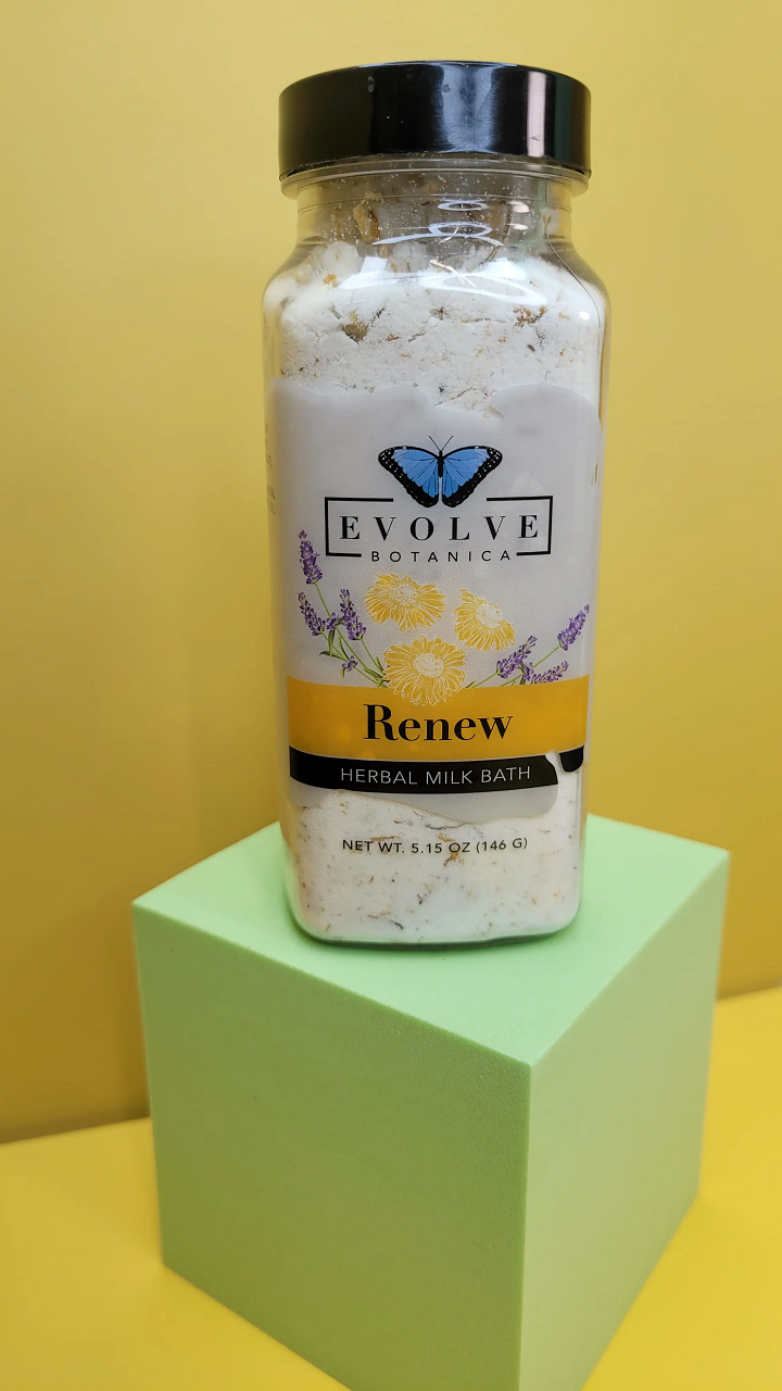 Herbal Milk Bath by Evolve Botanica with dried herbs and natural ingredients for a soothing, rejuvenating bath experience.