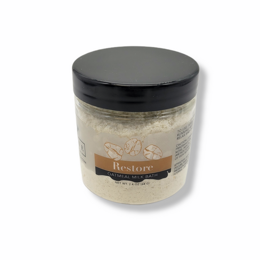 Mini Milk Bath Restore with Oatmeal by Evolve Botanica, showing a soothing, creamy milk bath product in a small jar.