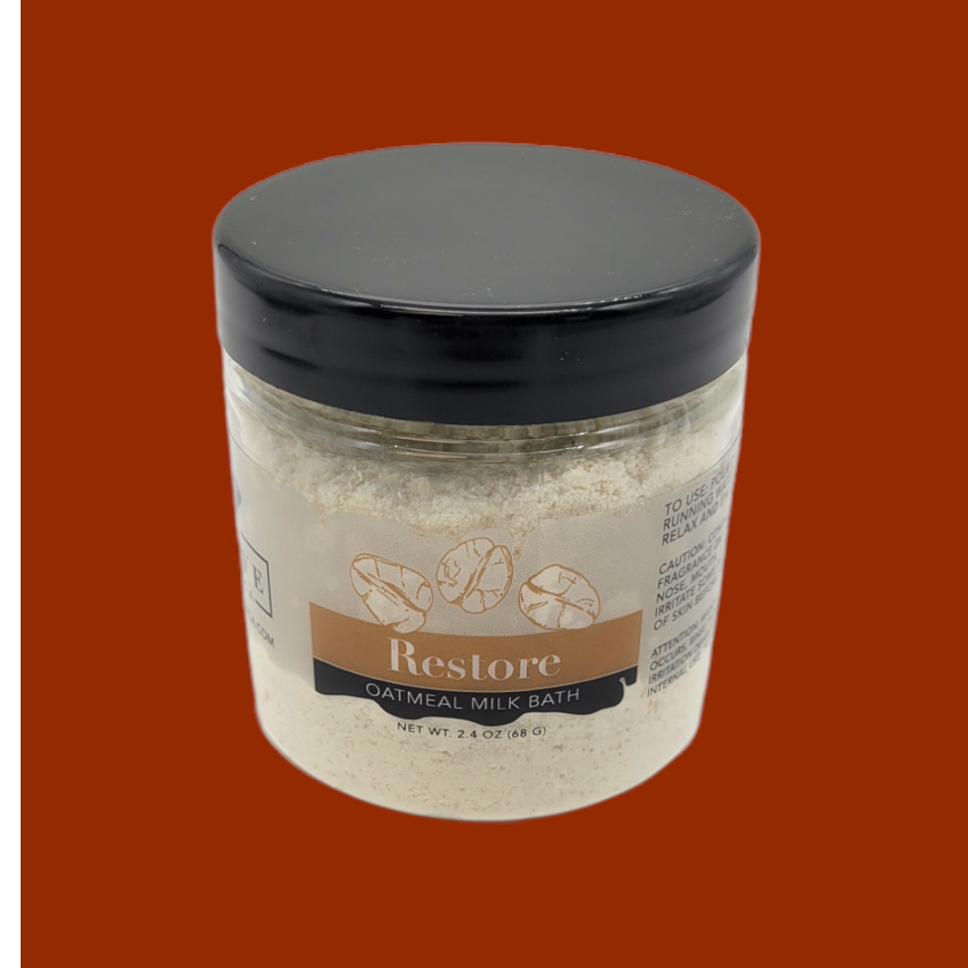 Mini Evolve Botanica Milk Bath Restore with Oatmeal in a jar, showcasing a soothing, creamy milk bath product for relaxing skincare.
