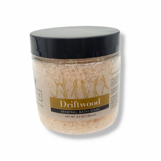Mini Evolve Botanica Mineral Soak Driftwood bath salt in a clear jar with a natural, textured driftwood-inspired appearance.
